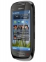Fotografías Frontal y Lateral derecho de Nokia C7 Negro. Detalle de la pantalla: Pantalla de inicio
